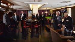 A photo of the Short Bar with many Royal Canadian Military Institute members enjoying a drink.